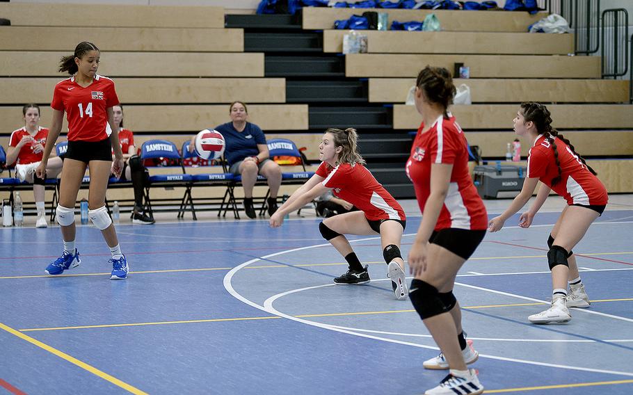 Lakenheath's Adrianna Christian, center, digs a ball while teammates, from left, A'lydia McNeal, Joraika Rodriguez and Victoria Pina follow during Division I pool-play action at the DODEA European volleyball championships on Friday at Ramstein High School on Ramstein Air Base, Germany.