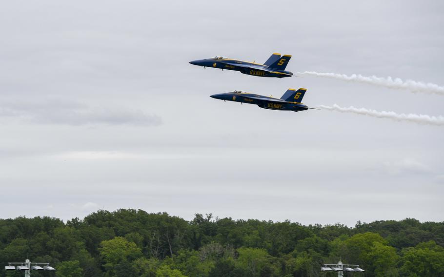 U.S. Navy flight demonstration squadron, the Blue Angels, perform in F/A-18 Super Hornets at the U.S. Naval Academy during commissioning week, May 24, 2022. The Blue Angels’ new Super Hornets are set to make their Seattle debut in this year’s Seafair air show over Lake Washington.