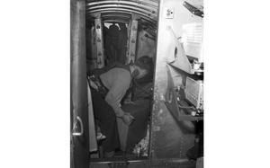 Capt. Eugene T. Williams, U.S. Air Force assistant German Youth Activities officer, throws candy out of the Bon Bon Bomber.