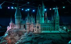 Visitors at the Warner Bros. Studio Tour The Making of Harry Potter admire the miniature model of Hogwarts School of Wizardry used during the movies. 