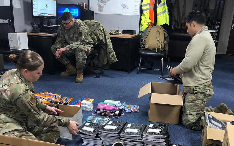 Tech Sgt. Fariht Gomez, right, and other service members package supplies donated by the RAF Lakenheath community in April to help a Maasai village in southern Kenya. Gomez has coordinated the collection of about two tons of items, including school supplies and clothing, he said.