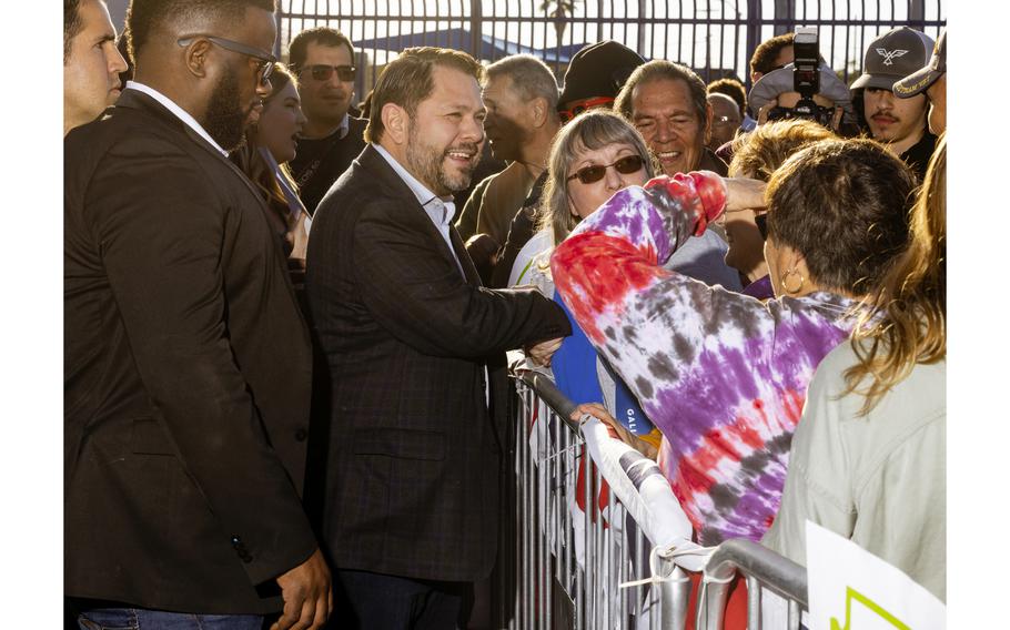 Rep. Ruben Gallego (D-Ariz.) meets supporters at a campaign event at Grant Park in Phoenix on Jan. 28, 2023. 