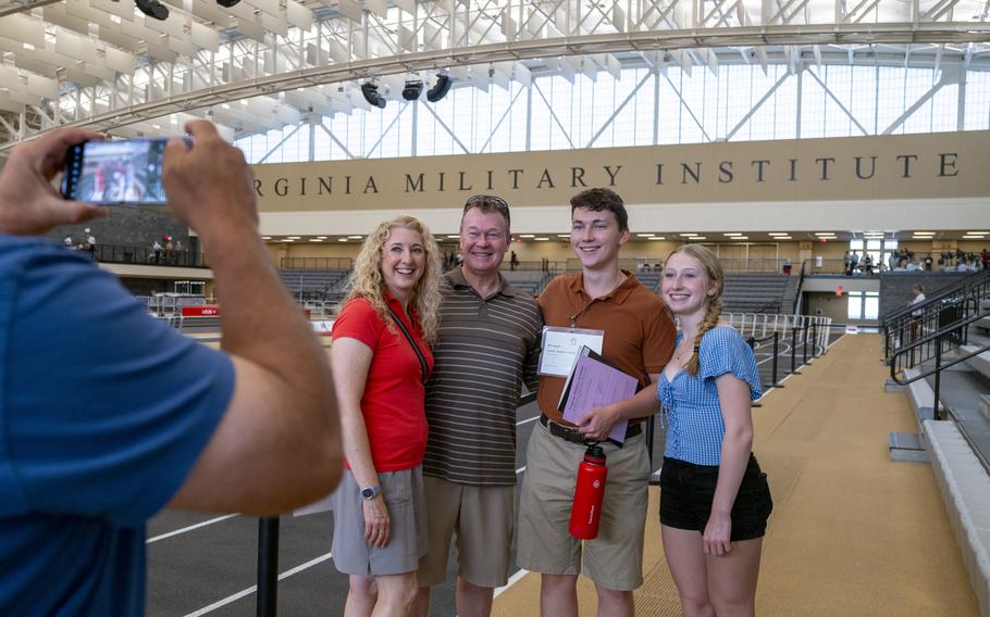 Liam Dougherty of Strasburg, Pa., second from right, with his mother Colleen, far left, father Bill and his sister Ivana inside the indoor track.