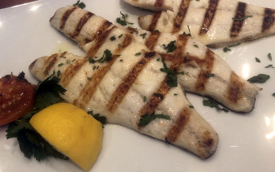 The fish duo of grilled sea bass, center, and sea bream fillets as served at the Parthenon restaurant in Frankfurt. While quite tasty, the presentation could have been nicer. The bass was a little juicier than the bream.
