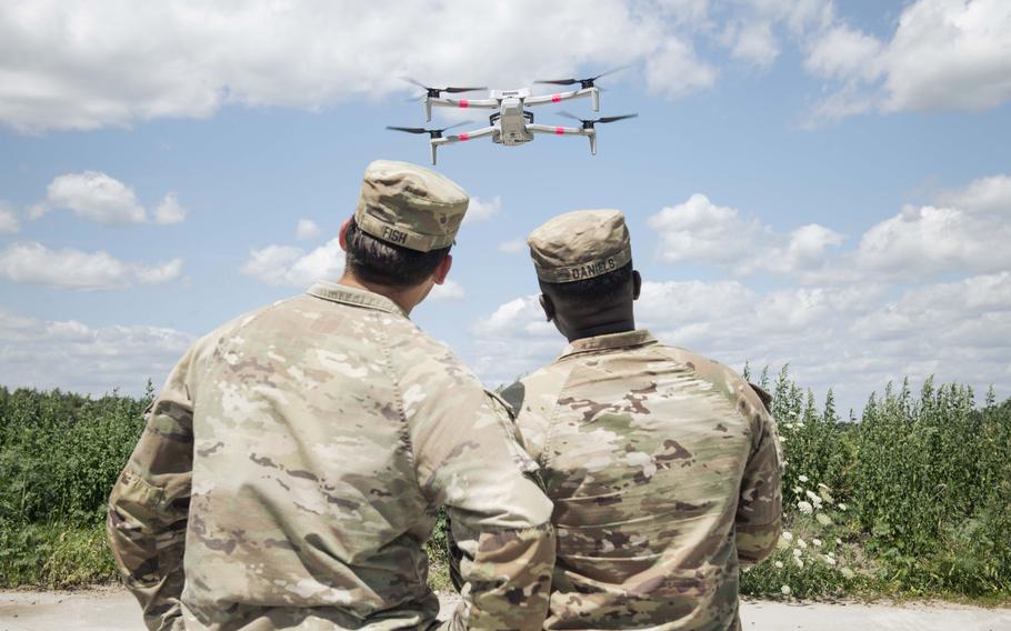 U.S. soldiers watch a Skydio X10D drone take flight.