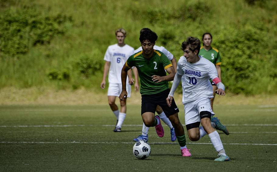 Sigonella Jaguar Mikolaj Czernielewski  pushes past Alconbury’s Taye Vickerstaff during the 2024 DODEA European Soccer Division III Championships in Landstuhl, Germany, on May 20, 2024.