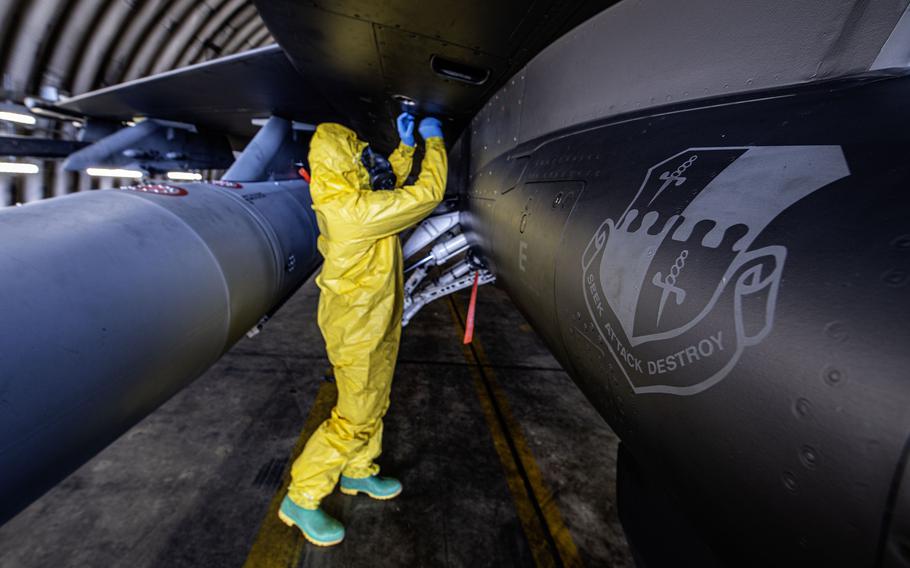 Tech. Sgt. Kayla Bradford, phase inspection dock chief with the 480th Fighter Generation Squadron, inspects an access door on an F-16 during exercise Radiant Falcon on April 24, 2024, at Spangdahlem Air Base, Germany.