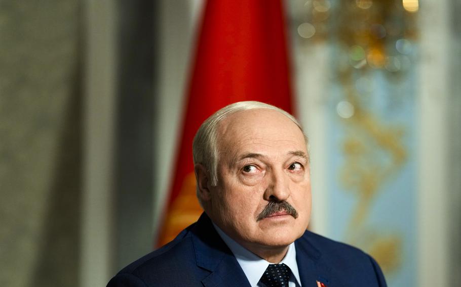 Belarus President Alexander Lukashenko listens to questions during an interview with The Associated Press at the Independence Palace in Minsk, Belarus, Thursday, May 5, 2022. (AP Photo/Markus Schreiber)