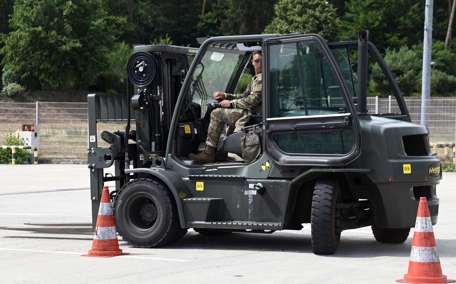 Staff Sgt. Daniel Smelser of the 48th Logistics Readiness Squadron, RAF Lakenheath, England, snakes his way through a labyrinth of cones during the Port Dawg Rodeo at Ramstein Air Base, Germany, July 6, 2022.