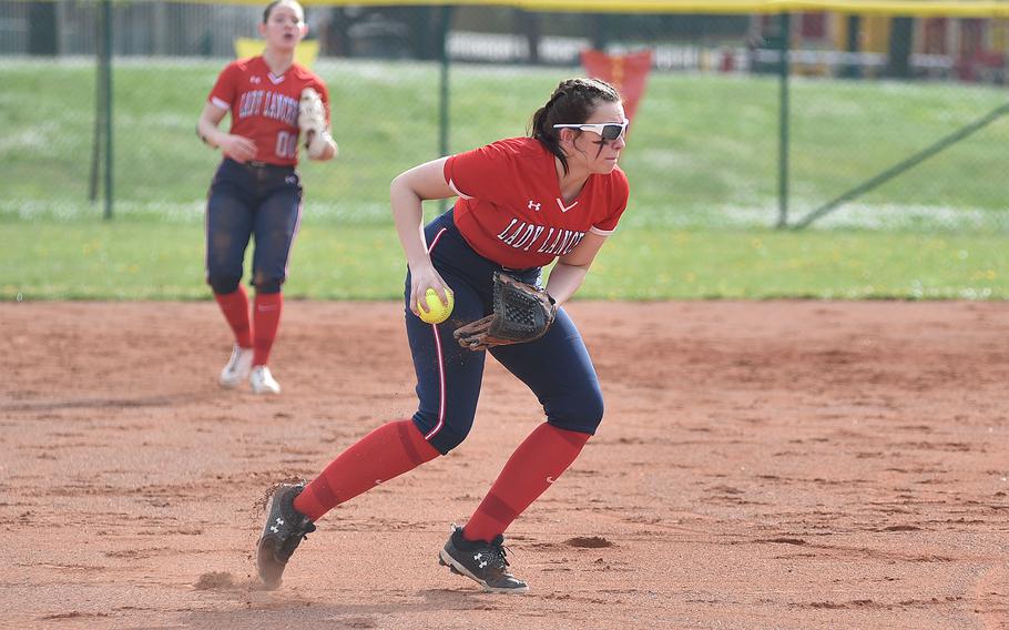 Lakenheath third baseman Audrey Young prepares to throw the ball to first base during the first game of an April 13, 2024, doubleheader against Ramstein on Ramstein Air Base, Germany.