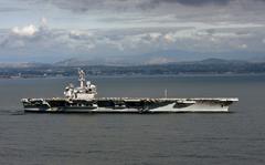 In this handout released by the U.S. Navy, The aircraft carrier USS Theodore Roosevelt (CVN 71) leaves its San Diego homeport in 2020. 