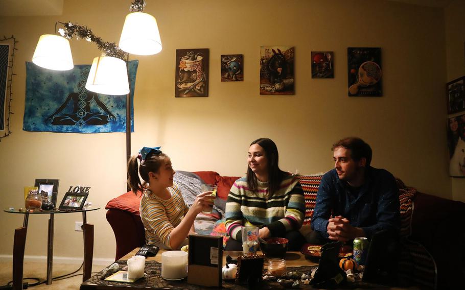 The Ervin family, from left, Sophie, 9, Payton and Matt, chat over dinner at their Naperville home on Nov. 11, 2021. The Ervins and their extended family are renting a house nearby to celebrate Thanksgiving this year, now that Payton and Matt are fully vaccinated with Sophie receiving her first shot on Nov. 9. 