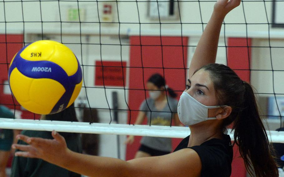 Junior setter Jillian Stevens is one of two players on Nile C. Kinnick's volleyball team who have their father as coach. Jillian's father is Red Devils assistant coach Travis Stevens and head coach Tony San Nicolas' daughter Cierra, a junior, is also on the team.