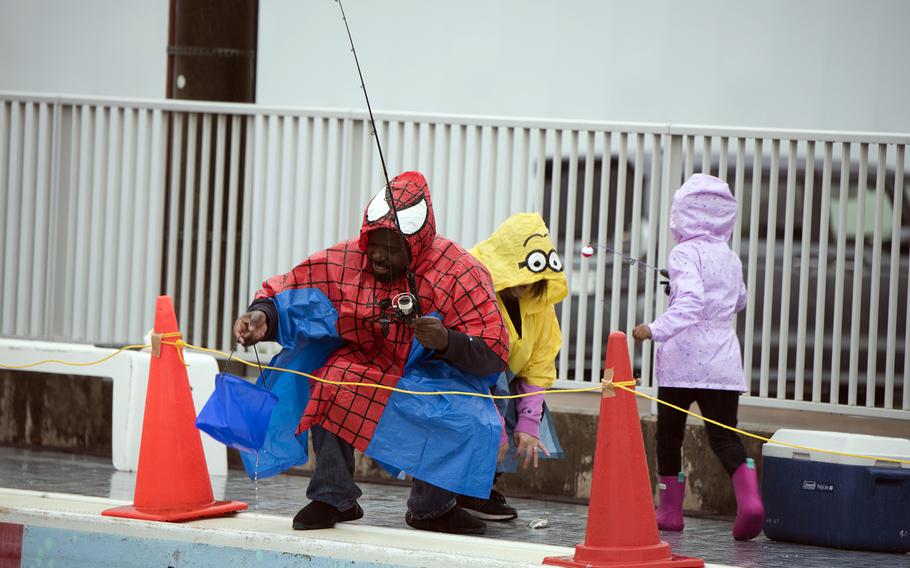 Timothy Bernard, a Child Development Center employee, and his family take part in the inaugural Sakana Trout Fishing Derby at Yokota Air Base, Japan, April 15, 2023. 