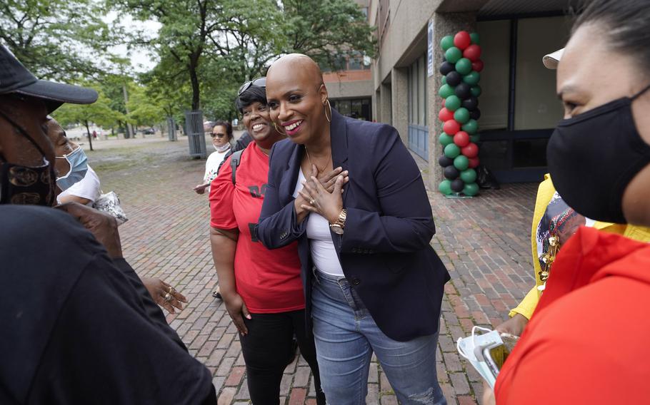 U.S. Rep. Ayanna Pressley, D-Mass., center, greets people before the start of the Roxbury Unity Parade July 18 in Boston's Roxbury neighborhood. 