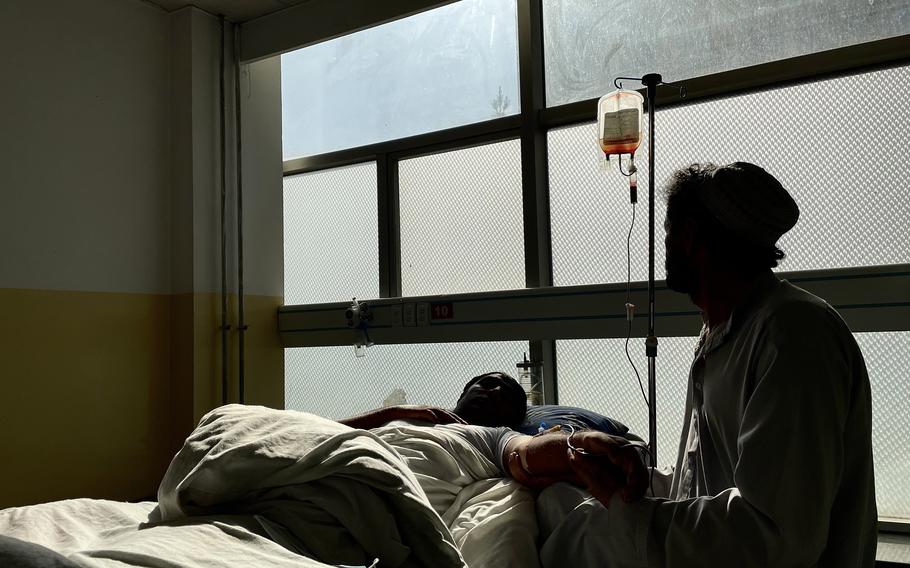 A nurse attends to a patient in Kabul's Jamhuriat hospital's emergency ward, in November. The ward has run out of critical supplies including dressings and insulin following the near halt in aid to Afghanistan. MUST CREDIT: Washington Post photo by Susannah George.