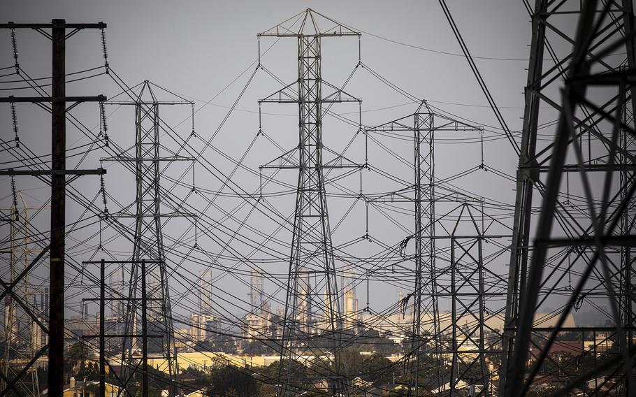 California’s electrical grid operator warned that a coming heat wave is likely to lead to Flex Alerts and other emergency measures. Above, power lines in Redondo Beach. 