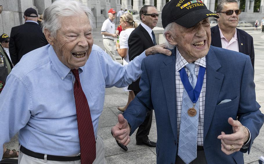 World War II veterans Les Jones, left, and Dave Yoho share a laugh before the 20th anniversary celebration of the National World War II Memorial in Washington, D.C., May 25, 2024.