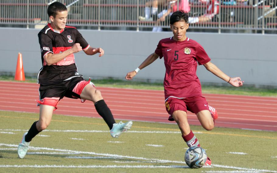Ethan Ongkeko kicks the ball.