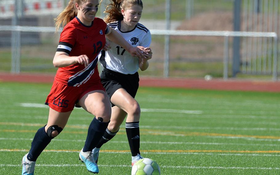 Lakenheath’s Sophia Yorko and Stuttgart’s Haley Wells battle for the ball in the girls Division I final at the DODEA-Europe soccer championships in Ramstein, Germany, May 18, 2023. Stuttgart beat Lakenheath 1-0 to win the title.