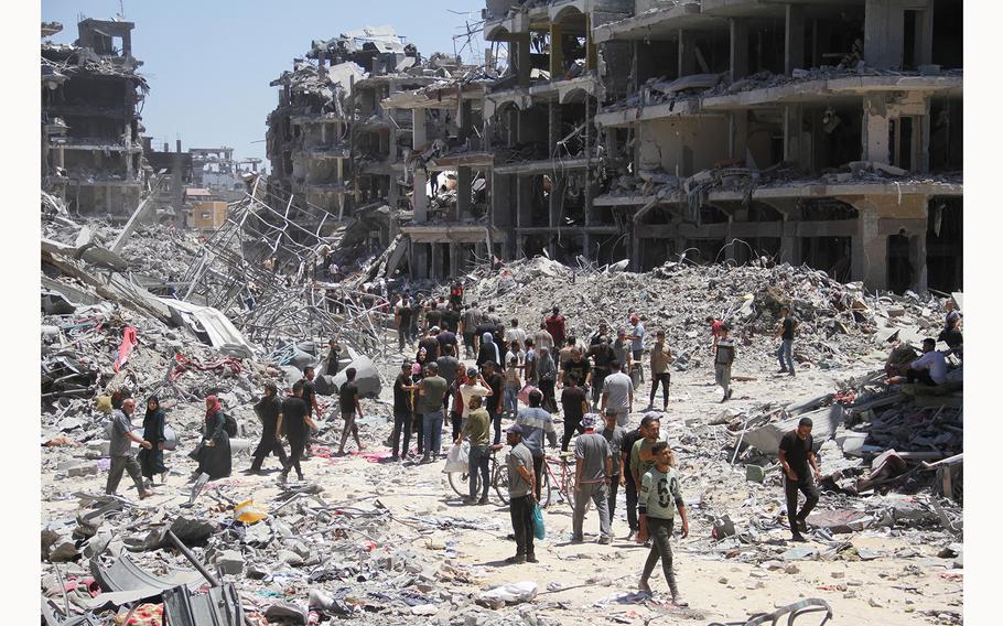 People roam yhe Jabalia camp in the Gaza Strip on May 31, 2024.