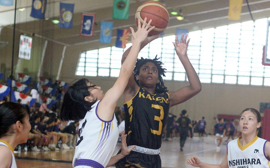 Kadena's NyKale Penn drives for a shot against Nishihara A during Saturday's pool-play game in the 16th Okinawa-American Friendship Basketball Tournament at the Camp Foster Field House. The Owls routed the Panthers 109-24.