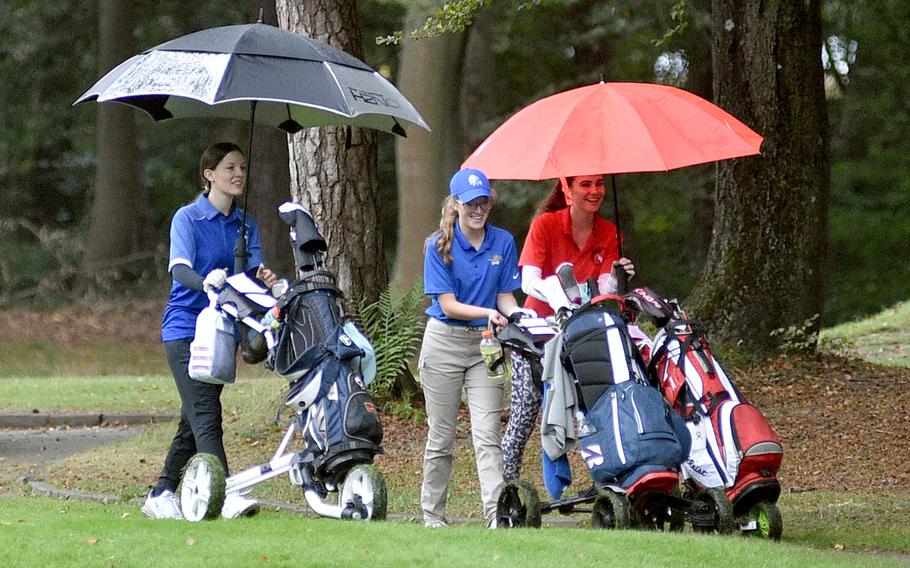 From left, Ramstein's Nora Hacker, Wiesbaden's Alyssa Shewell and Kaiserslautern's Shaelee Moneymaker-Donachie share a laugh during the first day of the DODEA European golf championships on Oct. 12, 2023, at Woodlawn Golf Course on Ramstein Air Base, Germany.