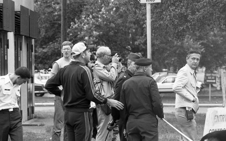 Press and onlookers at the scene of the deadly bombing at Rhein-Main Air Base.