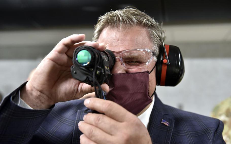 Chicopee Mayor John Vieau looks through a night vision scope in the new Small-Arms Indoor range at Westover Air Reserve Base.  Officials held a ribbon cutting ceremony for the new facility.