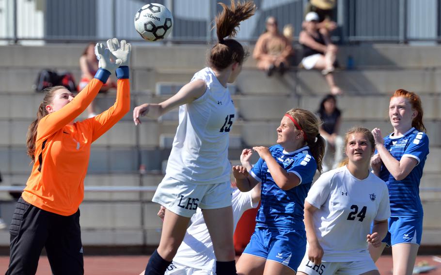 Lakenheath keeper Chloe Aldric hits the ball out of the box over teammates Mary Lowe and Sophia Yorko and Ramstein’s Abigail Belote and Gabriella Clark in a Division I girls semifinal at the DODEA-Europe soccer championships in Kaiserslautern, Germany, Wednesday, May 18, 2022. Ramstein won 1-0 to advance to Thursday’s final against Stuttgart.