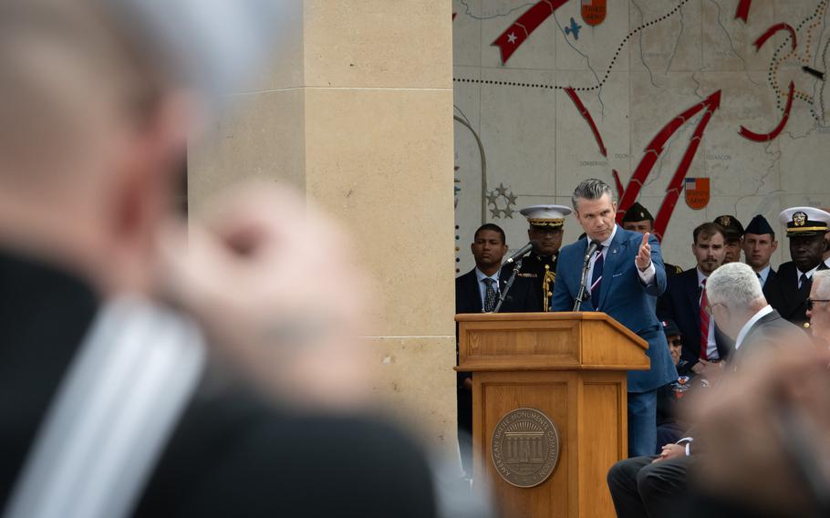 Defense Secretary Pete Hegseth speaks at a podium.