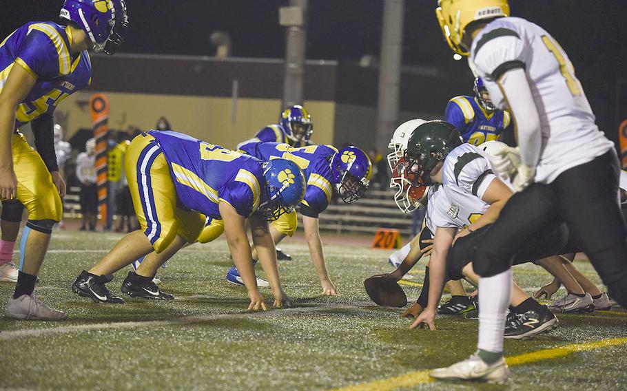 Robert D. Edgren offensive linemen push towards the Yokota 20-yard line during the homecoming game, Friday, Nov. 5, 2021.  