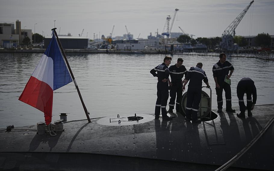 Sailors prepare a French Rubis-class submarine at the Toulon naval base in southern France, Monday, April 15, 2024. The nuclear powered submarine will be guarding France's Charles de Gaulle aircraft carrier during training exercises dubbed Neptune Strike in the Mediterranean with the 32-nation NATO military alliance.
