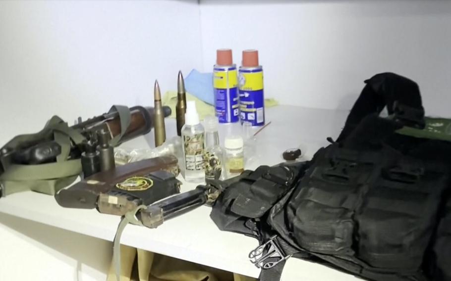This image taken from a video released by the Israeli Defense Forces on Nov. 15, 2023, shows a bulletproof vest with a Hamas insignia that was found along with weapons the IDF says were found in a medical closet at the MRI center at al-Shifa hospital in Gaza City. 
