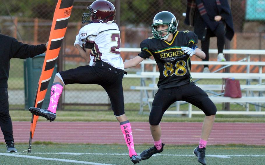 Perry's Billy Henry snags the first of his two interceptions.