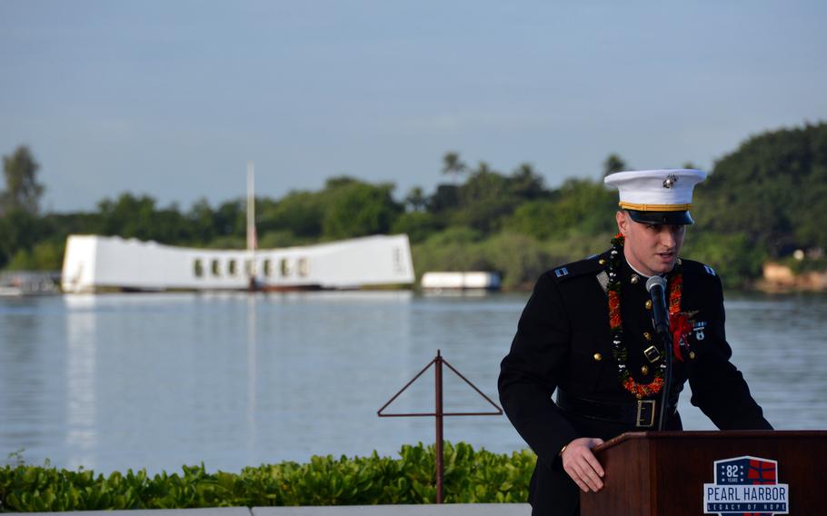 Flanked by the USS Arizona Memorial, Capt. Ray Hower, a third-generation Marine Corps pilot and great nephew to the sole living crew member of the USS Arizona, speaks Dec. 7, 2023, during the 82nd annual commemoration of the 1941 attack on Pearl Harbor, Hawaii.