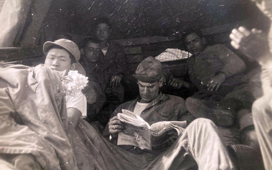 Army Cpl. Joseph Mellon reads a newspaper in this undated photograph from the Korean War.