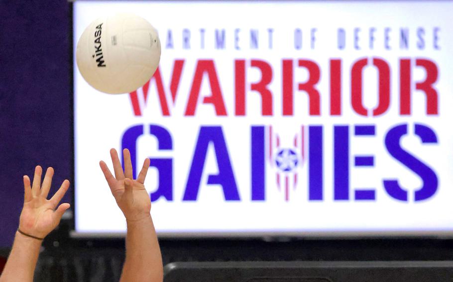 Retired U.S. Navy Petty Officer First Class Mark Coltrain returns a volley during a demonstration of sitting volleyball at a preview event for the 2022 Department of Defense Warrior Games, at ESPN Wide World of Sports at Walt Disney World, Tuesday, July 26, 2022.  Hosted by the U.S. Army, the Warrior Games will take place at the complex August 19-28, showcasing wounded, ill and injured active-duty and retired U.S. military service members.