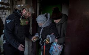 In this undated photo, Pete Reed assists in an evacuation in Ukraine. Reed, a humanitarian, paramedic and U.S. Marine Corps veteran who had gone to work in Ukraine assisting people afflicted by the war, was killed in a front-line explosion on Thursday, according to his wife and the nonprofit organization they co-founded. 