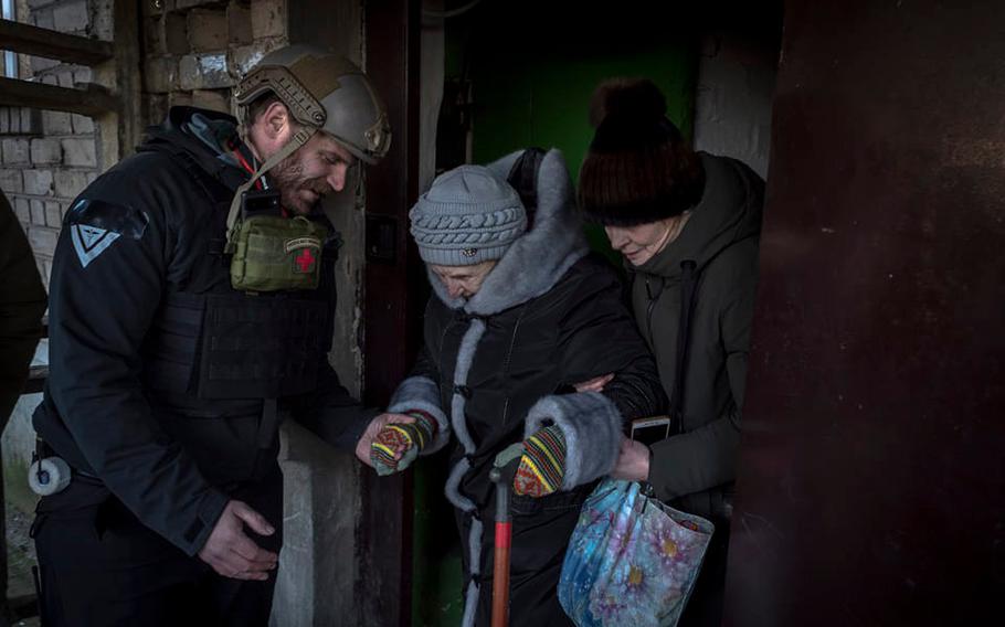 In this undated photo, Pete Reed assists in an evacuation in Ukraine. Reed, a humanitarian, paramedic and U.S. Marine Corps veteran who had gone to work in Ukraine assisting people afflicted by the war, was killed in a front-line explosion on Thursday, according to his wife and the nonprofit organization they co-founded. 