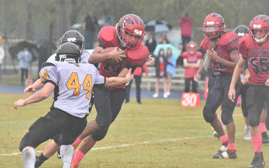 Aviano's Malakai Harkley tries to get by Vicenza tacklers in the Saints' 40-0 victory over the Cougars on Saturday, Oct. 22, 2022.