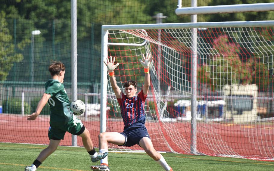SHAPE’s Marten Muurisepp gets the ball past oncoming Lakenheath goalkeeper Matthew Vasquez on Monday, May 19, 2025, at the DODEA-Europe Division I boys soccer championships in Kaiserslautern, Germany. Marten Muurisepp scored, but the Lancers won 2-1.