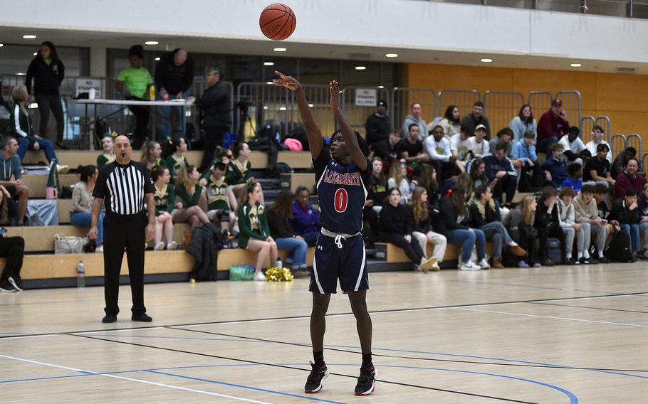 Lakenheath junior Gideon Toure shoots a free throw from a Vilseck technical foul during pool-play action of the DODEA European basketball championships on Feb.14, 2024, at the Wiesbaden Sports and Fitness Center on Clay Kaserne in Wiesbaden, Germany.