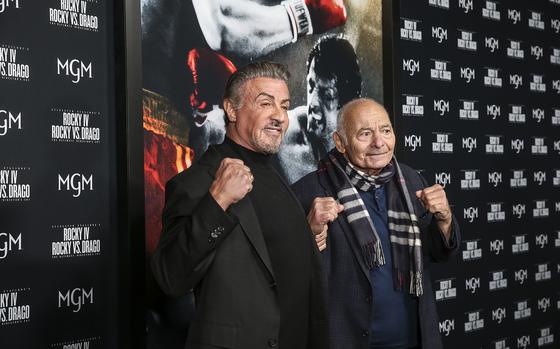 Sylvester Stallone, left, and Burt Young attend a "Rocky IV" screening at the Philadelphia Film Center on Nov. 11, 2021, in Philadelphia. Young who became famous for his role in “Rocky,” died Oct. 8, 2023, at age 93. (Steven M. Falk/The Philadelphia Inquirer/TNS)