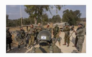 Israeli soldiers gather near the Israeli-Gaza border in southern Israel before they enter Gaza Strip, on Wednesday, May 1, 2024. 