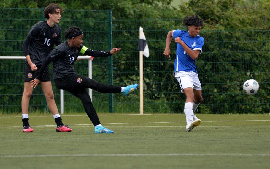 Bahrain’s Lindokuhle Latsoko shoots on goal as Rota’s Christian Smith tries to block in a Division II game at the DODEA-Europe soccer finals at Reichenbach-Steegen, Germany, May 21, 2024. Bahrain beat the Admirals 5-0.