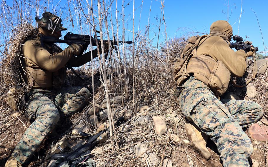 Marines simulate a battle during a convoy operation at Dagmar North Training Area in Paju, South Korea, Tuesday, Feb. 21, 2023.