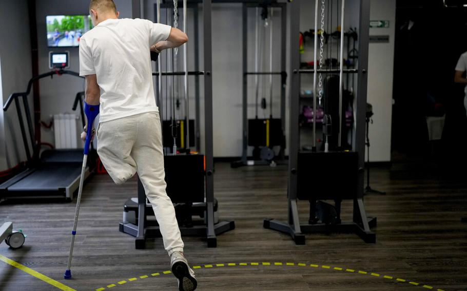 “Buffalo” trains his new prosthetic limb at a clinic in Kyiv, Ukraine, on June 17, 2022. “Buffalo” is among the wounded survivors that were evacuated during the last-ditch defense of the Azovstal steel mill after exploding 120mm mortar rounds tore apart his left leg, Buffalo says: “The absence of a leg is a challenge, not a problem’.