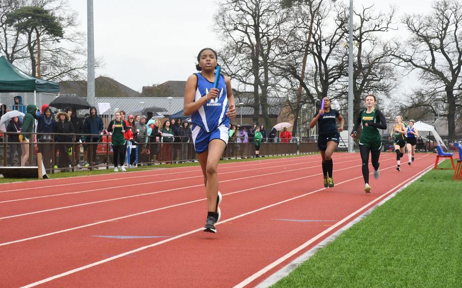 Brussels' Amaia Sharrock leads the sprint medley relay on the final leg ahead of Lakenheath's Ciera Roberts and Alconbury's Evie Cummings on Saturday, March 18, 2023 at RAF Lakenheath High School during the track season opener. 