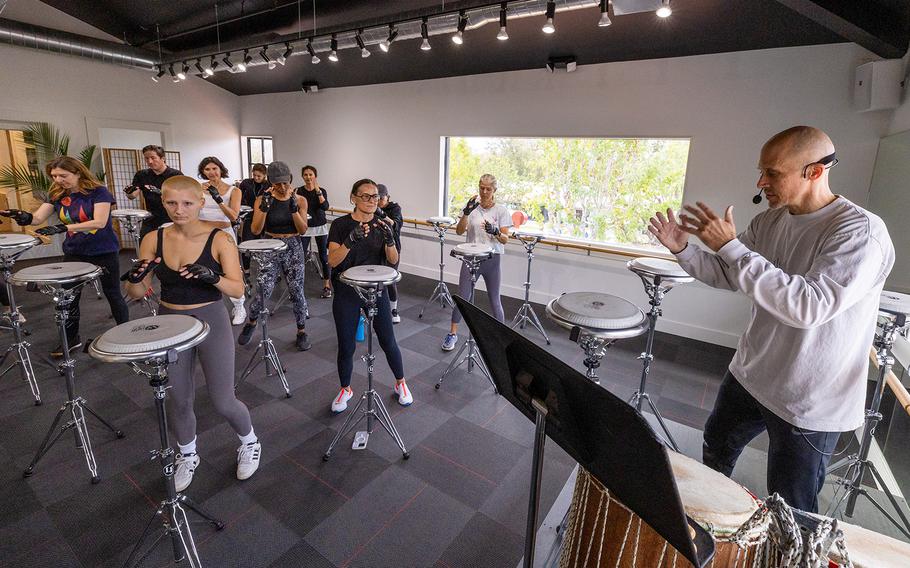 John Wakefield, right, a percussionist for the Los Angeles Opera, leads a Drumboxing class, combining Afro-Cuban rhythms, boxing moves and a Simon Says-like game. He developed the so-called “brain fitness” technique and taught it privately to boxers and other athletes for more than a decade before opening up a Malibu studio with his business partner, former pro beach volleyball player Christina Hinds, earlier this year.